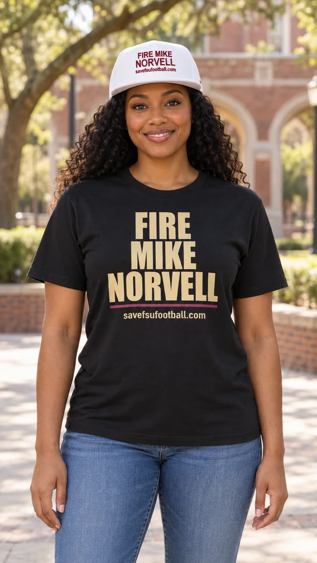 Model wearing the black Fire Mike Norvell shirt and white embroidered hat